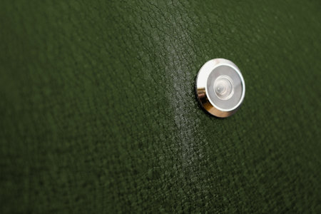 Isolated metal door and peephole: background and textureの写真素材