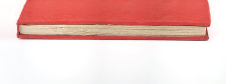 Red notebook handmade isolated on a white backgroundの写真素材