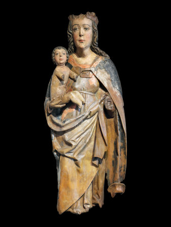 Gothic wooden sculpture Madonna and Child isolated on black background, high resolution. Design element with clipping pathの写真素材
