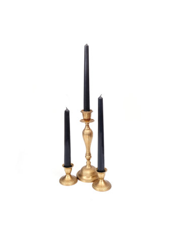 Row of gold candlesticks with black candles isolated on white background, cutout ready. Extremely high resolutionの写真素材