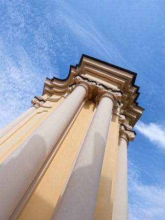 Low angle view of classic architecture columns against blue skyの写真素材