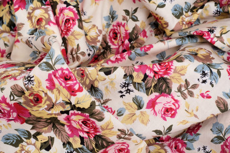 Vintage floral fabric texture. Beige background with roses pattern