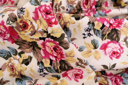 Vintage floral fabric texture. Beige background with roses pattern