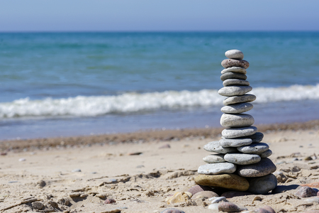stones pyramid on the beachの写真素材