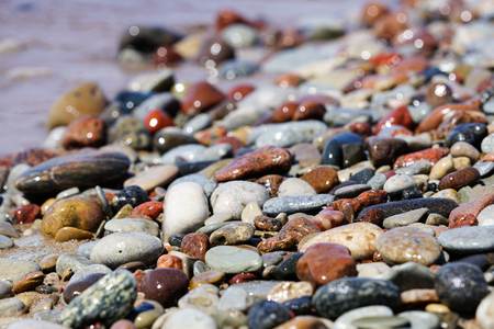 Beautiful colorful rocks on beachの写真素材