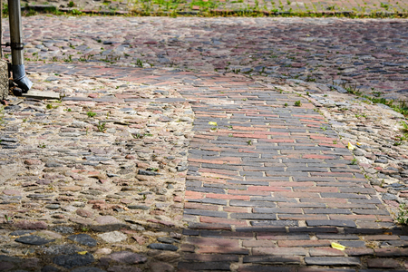 view of an older paved street with stone blocksの写真素材
