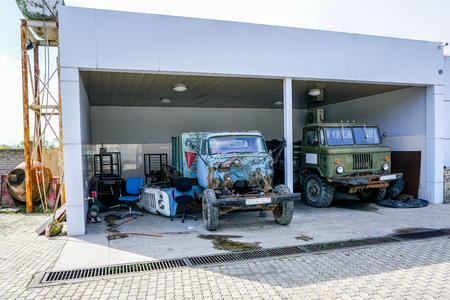 Service station with old rusty disaassembled soviet trucks, Georgiaの写真素材