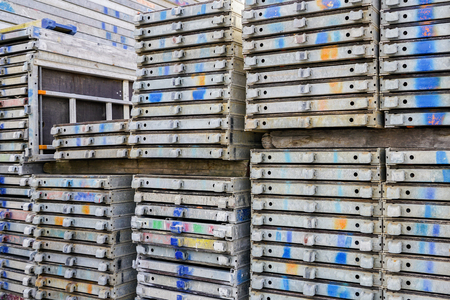 many stack of steel scaffold stuffs at open air warehouseの写真素材