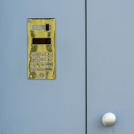 electronic access control door box with numeric keypad on grey background