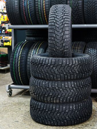 new winter tire set with studs at tire shopの写真素材