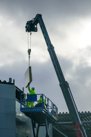 sandwich panels wall mounting using crane and scissor lift