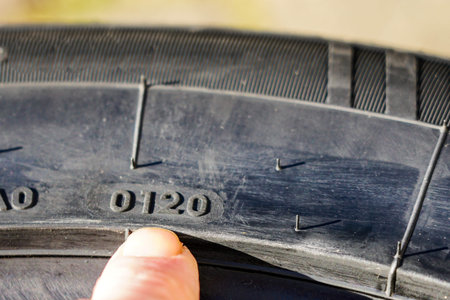 Side view of new tire with designation of week and year of tire production