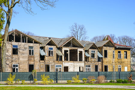 a large old wooden house freed from damaged elements and prepared for reconstructionの写真素材