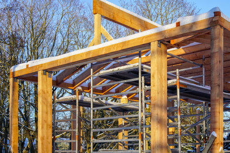 modern wooden construction building frame in the construction processの写真素材