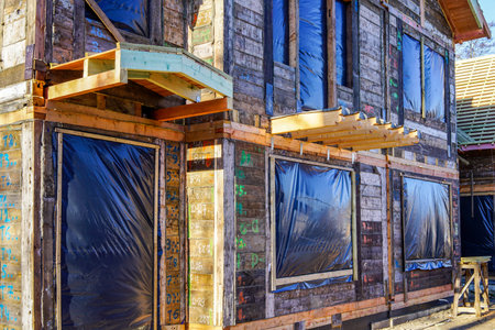 restoration of an old wooden house by numbering, dismantling, assembling and replacing the damaged...