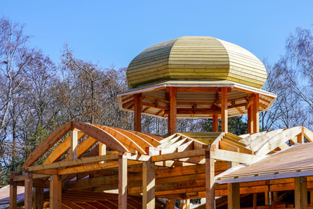 new wooden building frame with a round domed tower frame