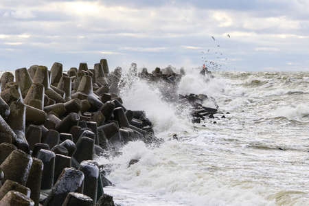 Stormy Baltic sea, port entrance concrete breakwater, Liepaja, Latviaの写真素材