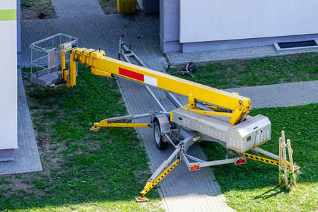 inspection of the house facade with the help of a modern mobile self propelled hydraulic lifting...