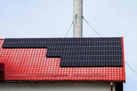 new solar batteries on roof top, clear energy of the sun