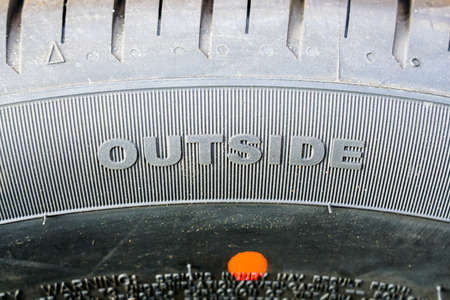 text on tire sidewall indicating direction for wearing the tires on the wheelsの写真素材
