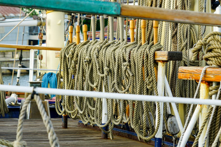 view of a rigging fragment of a historic sailing ship with lots of ropes
