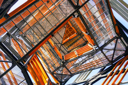 a fragment of the structure of a new modern metal observation tower with decorative wooden elements and circular staircaseの写真素材