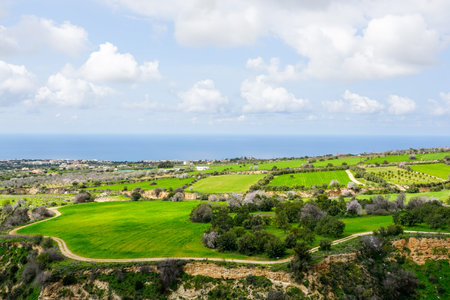 Beautiful spring nature landscape in Cyprus with green fields and the Mediterranean coast in the...