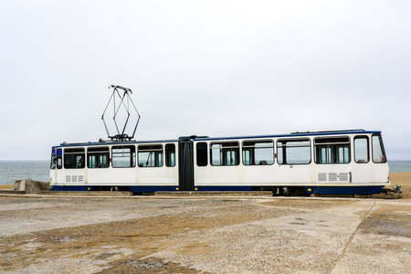 A used white electric tram car on the shore of the Baltic Sea for creating a cafe, tram as a cafe, Liepaja, Latviaの写真素材