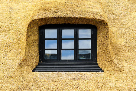 New thatch roof over house with dormer window in Denmark, Europe, thatched roofの写真素材