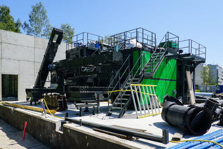 New modern unfinished wood chip biofuel boiler house for increased heat energy production efficiency
