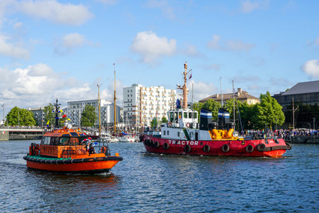 Liepaja, Latvia- July 07, 2023: Annual sea festival ship parade in Liepaja harbour channel, pilot...