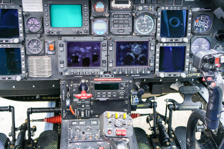 Interior view of helicopter Agusta cockpit with control pedals, dashboard, displays, selected focus,...