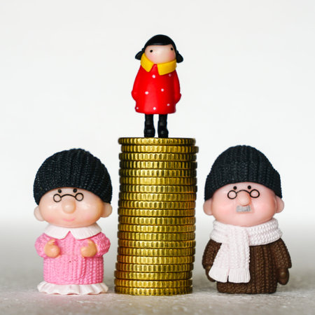 Between elderly grandfather and grandmother toy figures a pile of coins with a child on it, concept...