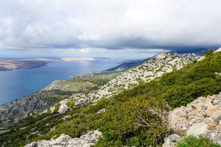 Typical Croatian, Dalmatian Adriatic seaside landscape with green, stony and sandy peninsulas and islands, diverse nature views, turquoise color waterの写真素材