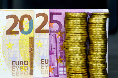Year 2025 from Euro notes, euro banknotes arranged in 2025, year symbol 2025 written with euros bank...