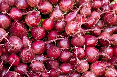 Closeup of fresh red beets on display at the farmers marketの写真素材