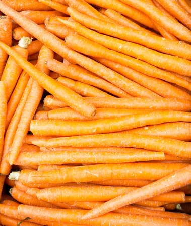 A bulk display of freshly dug carrots ready for saleの写真素材