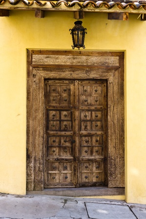 An old wooden door with metal detailsの写真素材