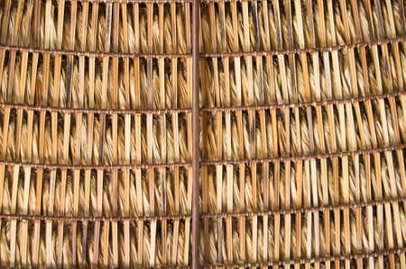 The woven thatch roof of a tropical shelterの写真素材