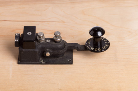 A vintage telegraph key sitting on a deskの写真素材