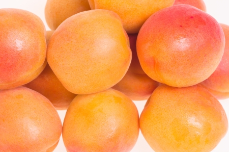 Ripe fresh apricots on whiteの写真素材