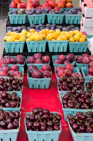 Display of boxes of fresh fruit at the marketの写真素材