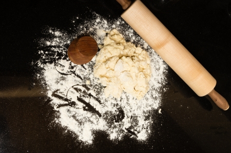 Biscuit cutter and rolling pin ready to make biscuitsの写真素材