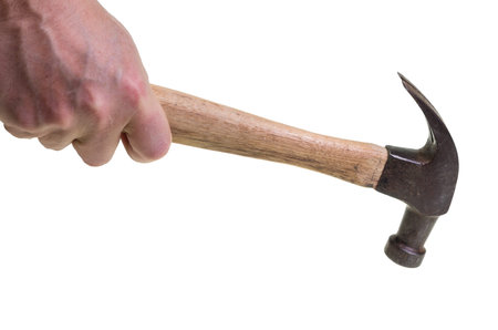 A carpenter swinging a hammer isolated on white