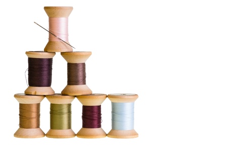 Seven spools of sewing thread isolated on whiteの写真素材