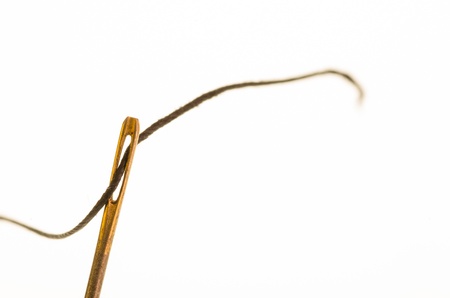 A needle with sewing thread through the eyeの写真素材