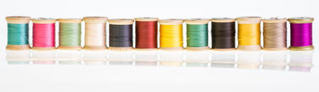 A row sewing thread with reflection