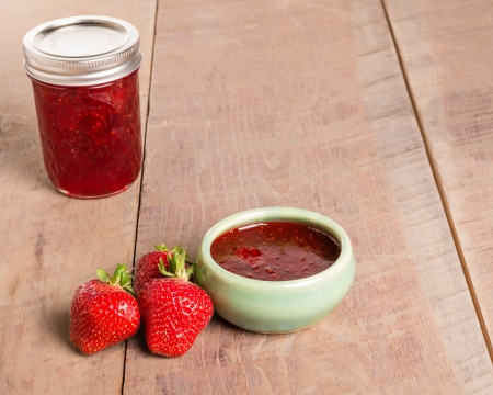 Fresh strawberries and homemade preserves or jellyの写真素材