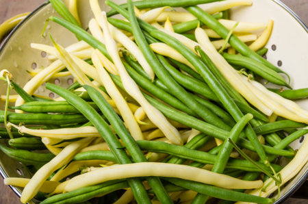 A bowl of of freshly picked green and yellow beans