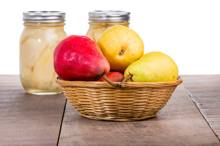 Red and yellow pears with canned pearsの写真素材
